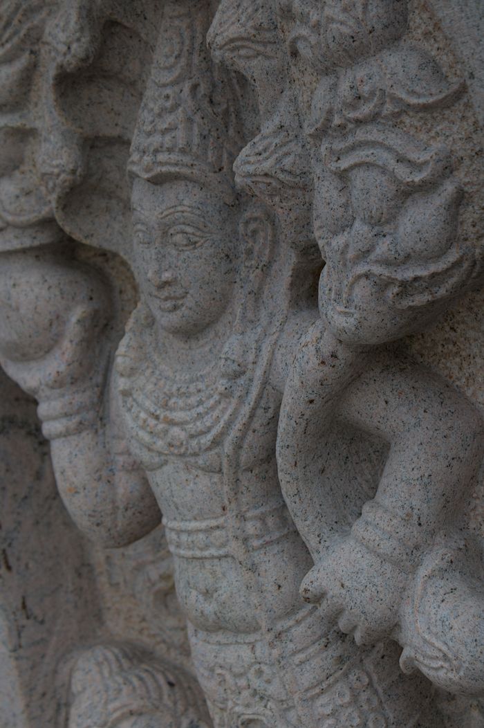 Intricate stone carving of a Hindu deity in Sri Lanka, showcasing traditional art and culture.